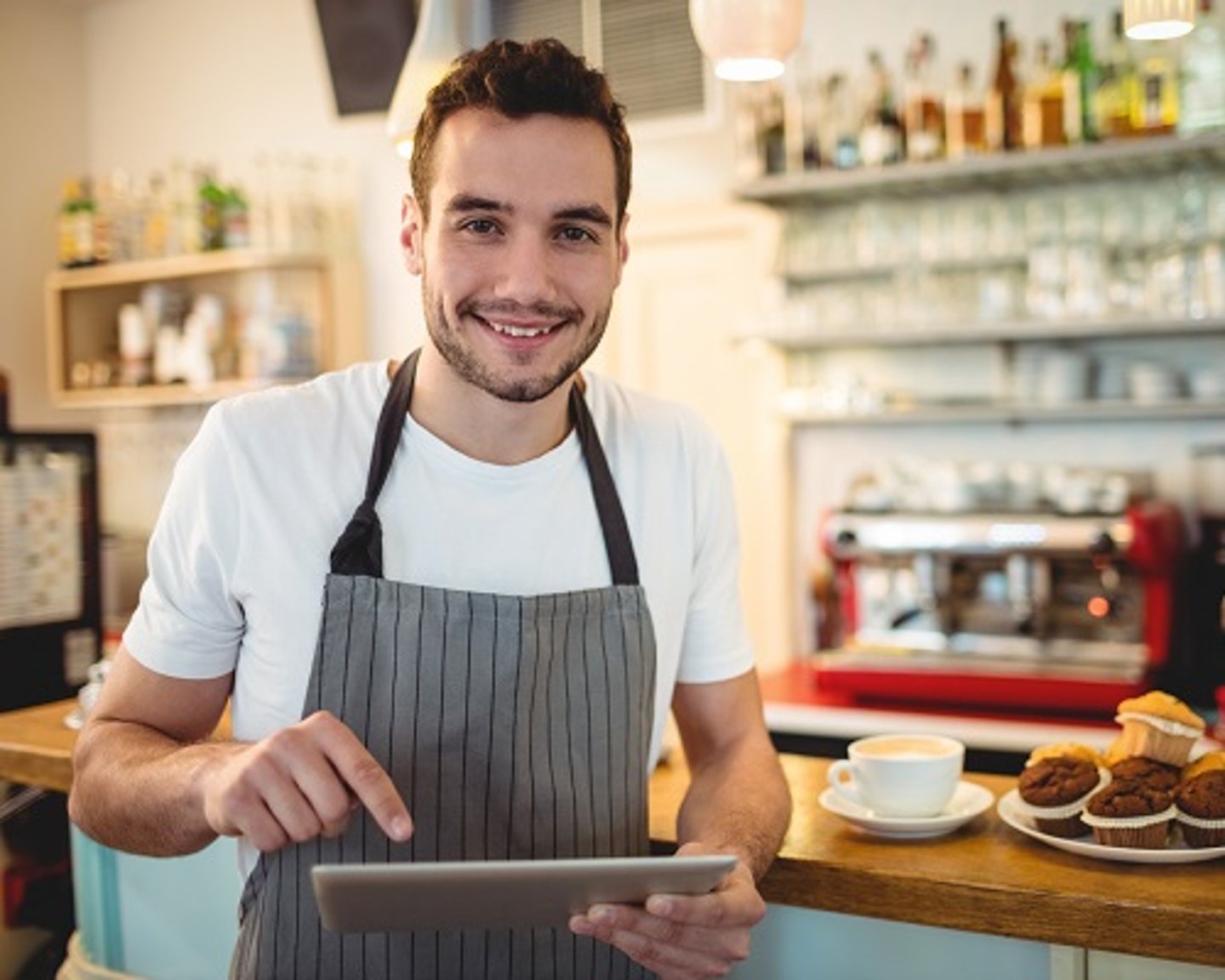 a man standing in front of a table