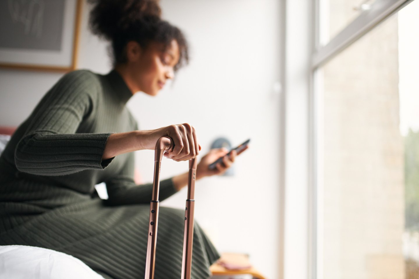 woman in hotel room on phone