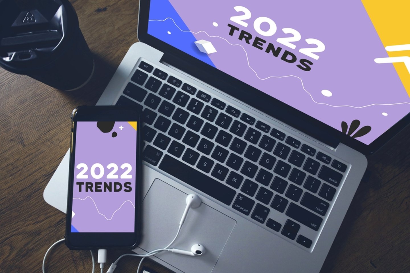 Laptop and cell phone with 2022 trends written on them