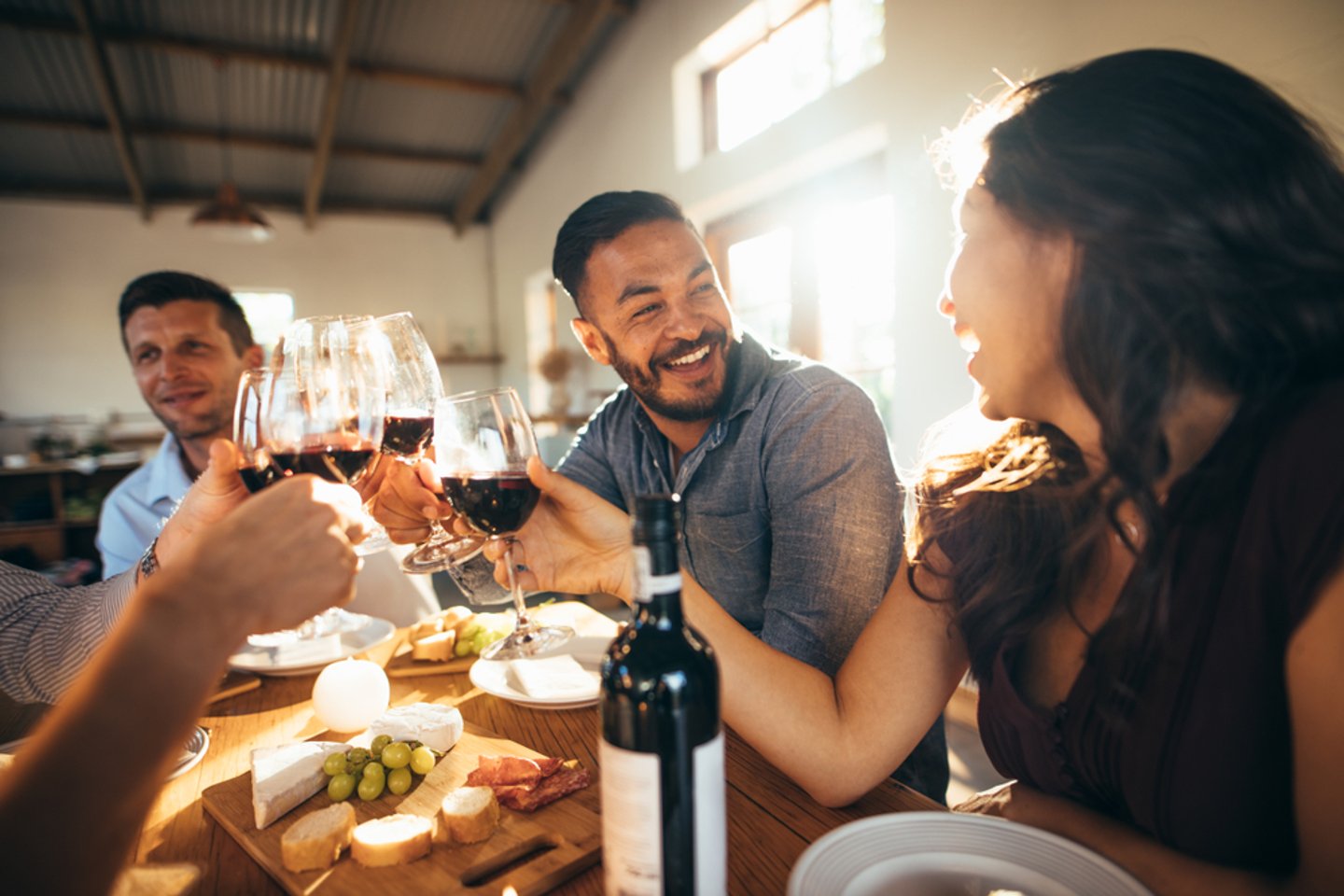 Restaurant diners laughing and eating