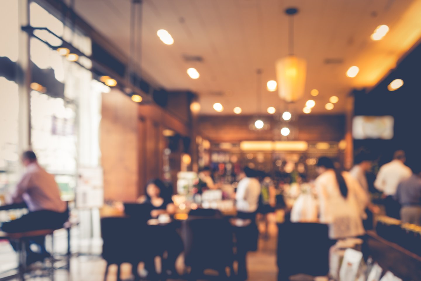 a man and a woman sitting in a restaurant