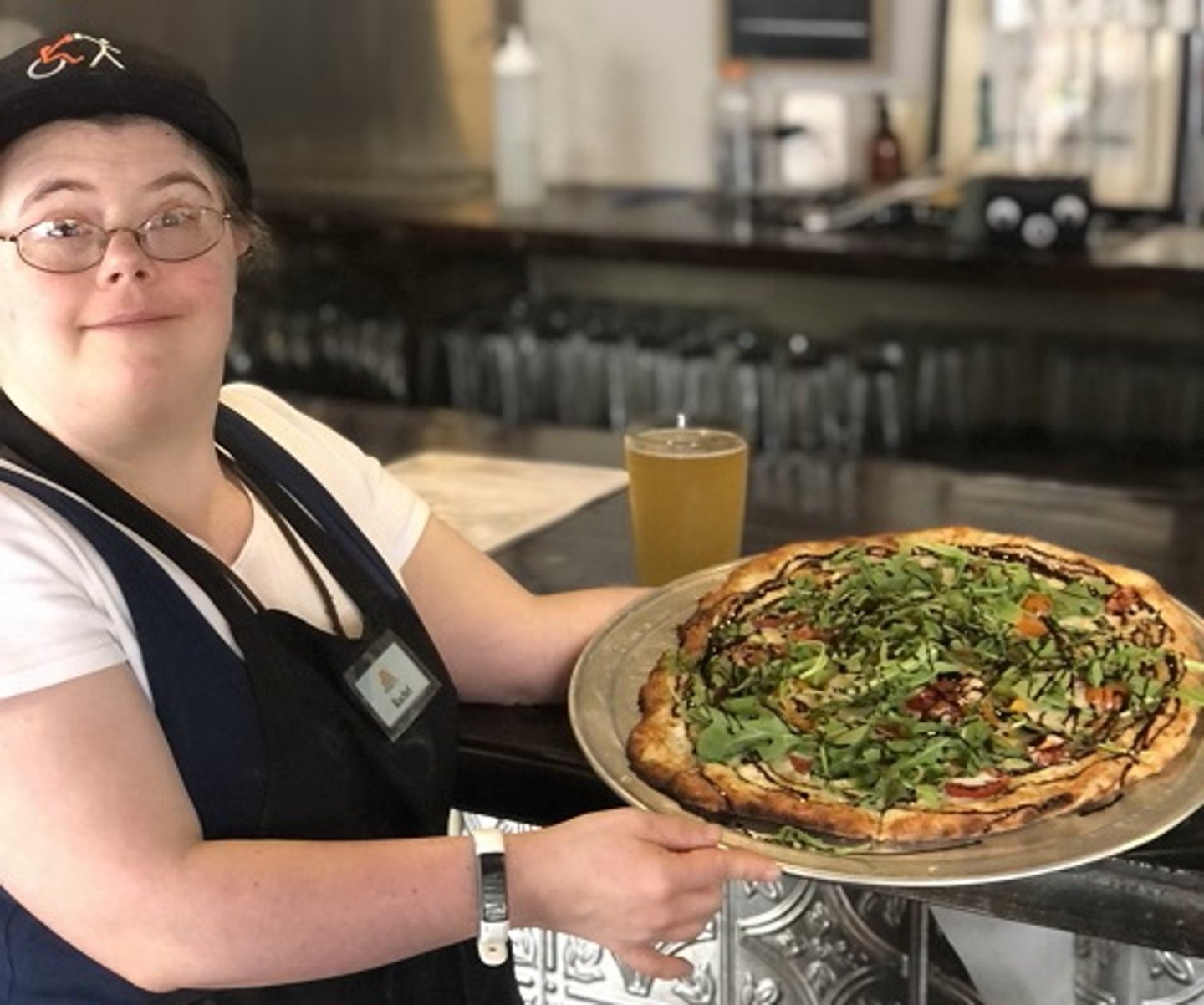 server with pizza at Brewability