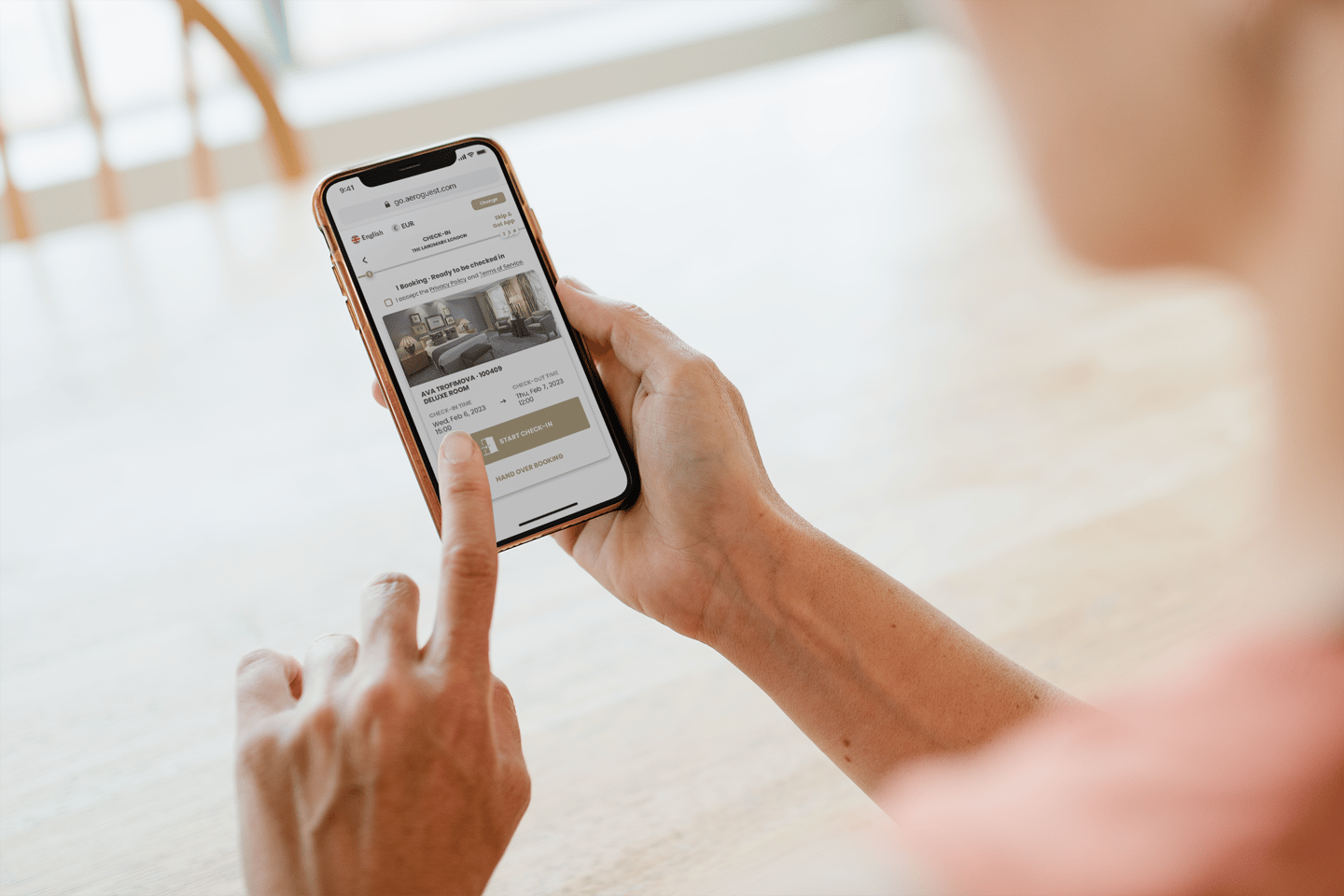 person making a hotel booking via their phone