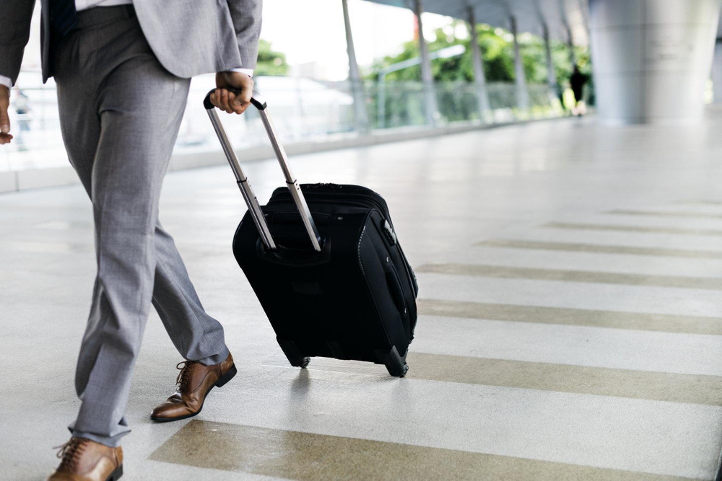 a person holding a bag of luggage