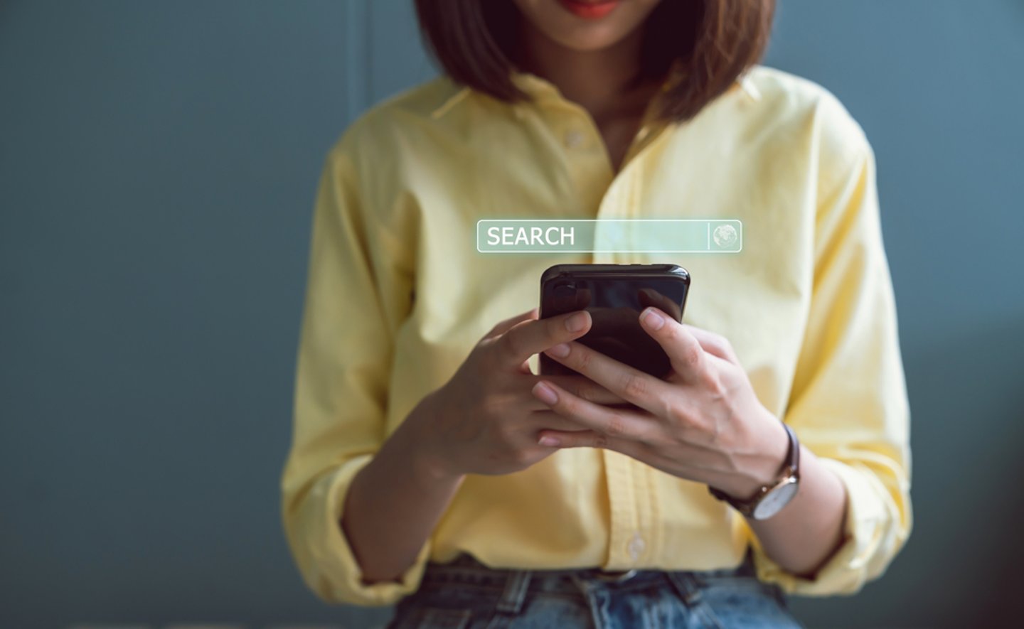 woman doing a search on a cellphone