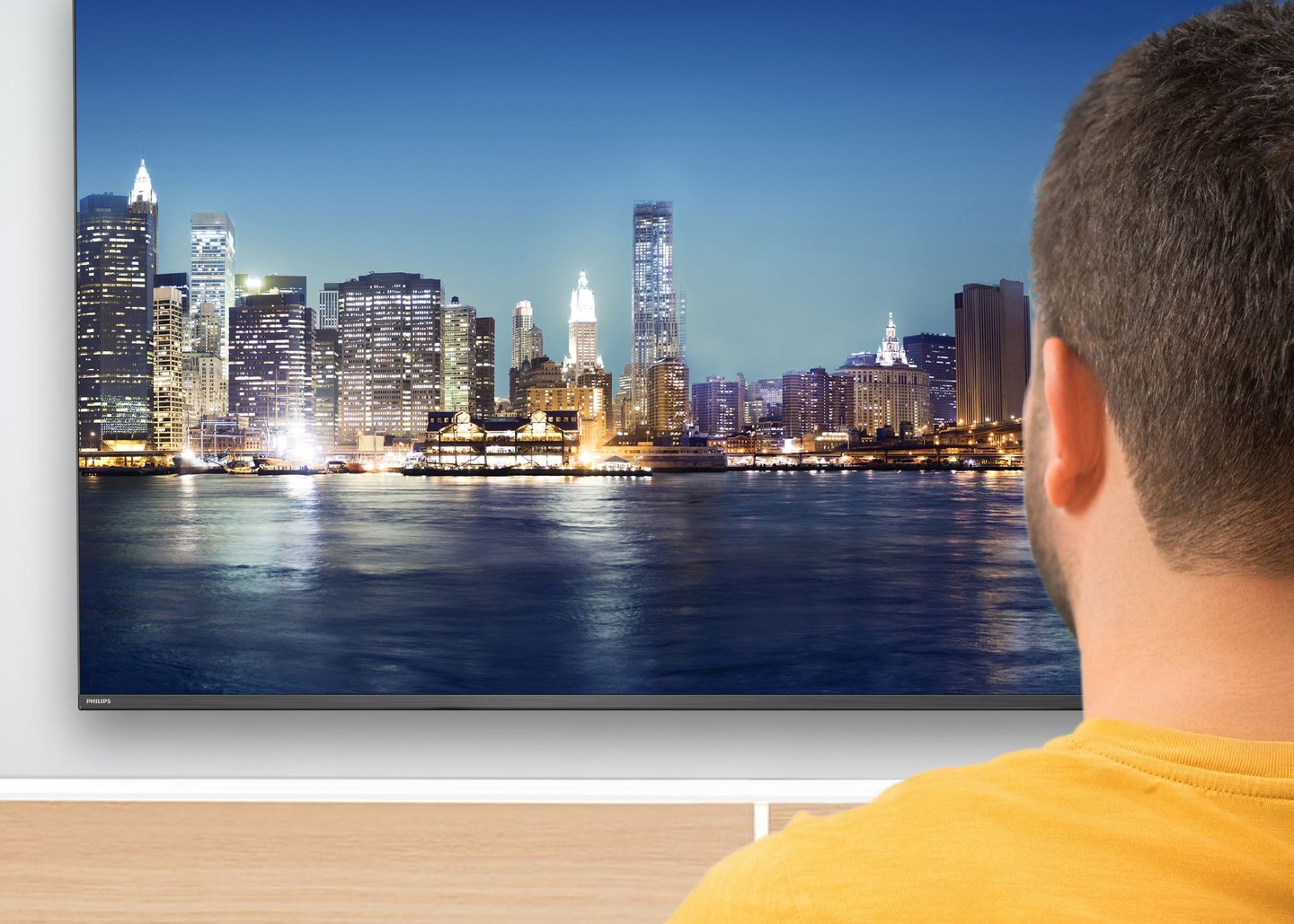 a man looking at a tv