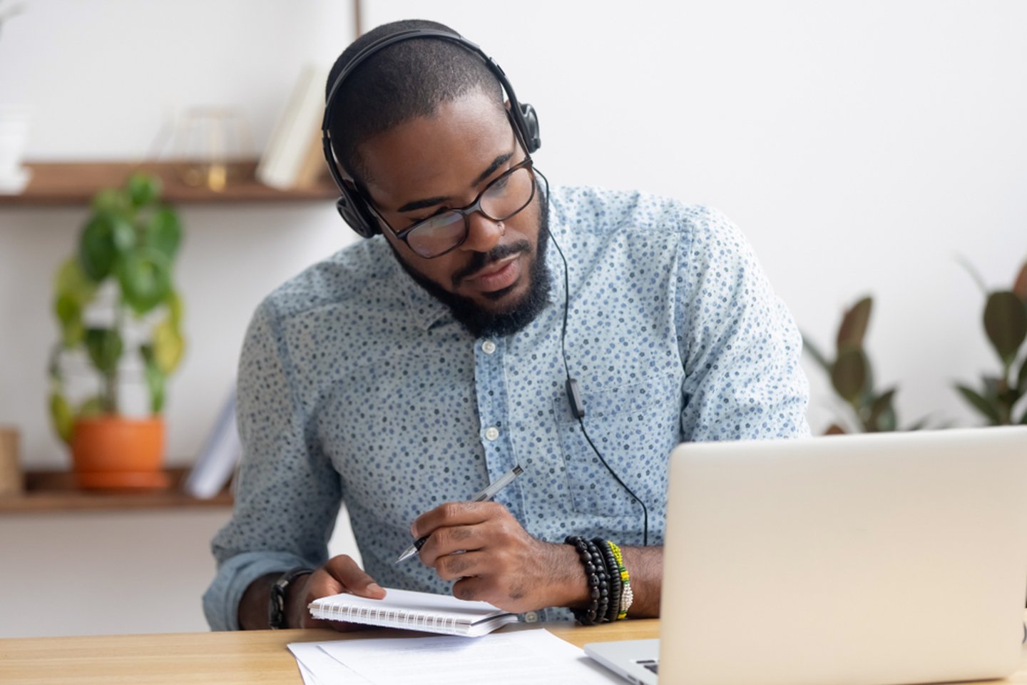 man listening to online training session