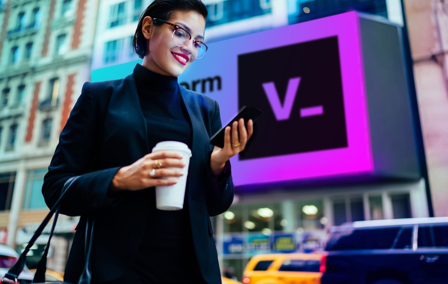 woman looking at smart phone on the street