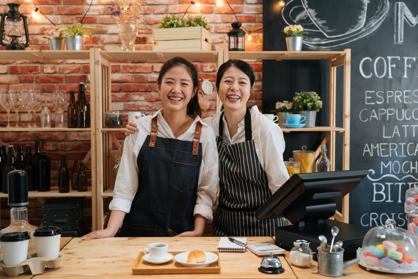 employees smiling in a coffee shop