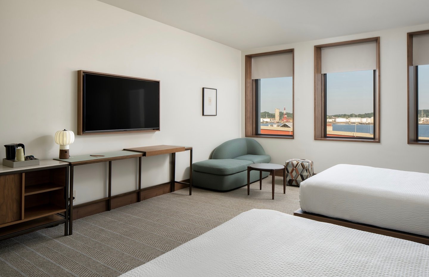 Hotel Marcel guestroom featuring automated window shades
