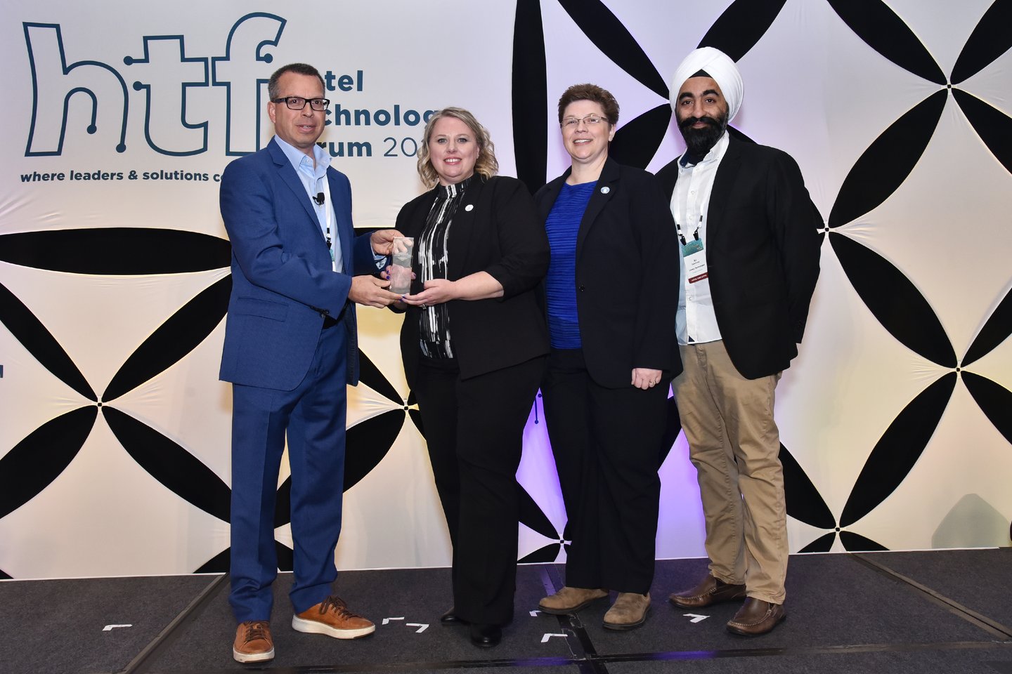 Wyndham, Canary Technologies accept 2024 Hotel Visionary Award in the Partnership Category