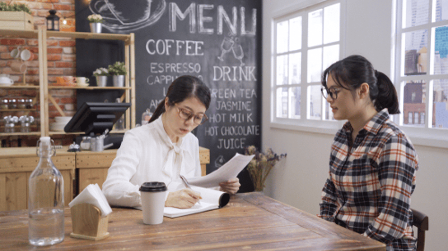 job interview at a coffee shop with a manager and potential employee