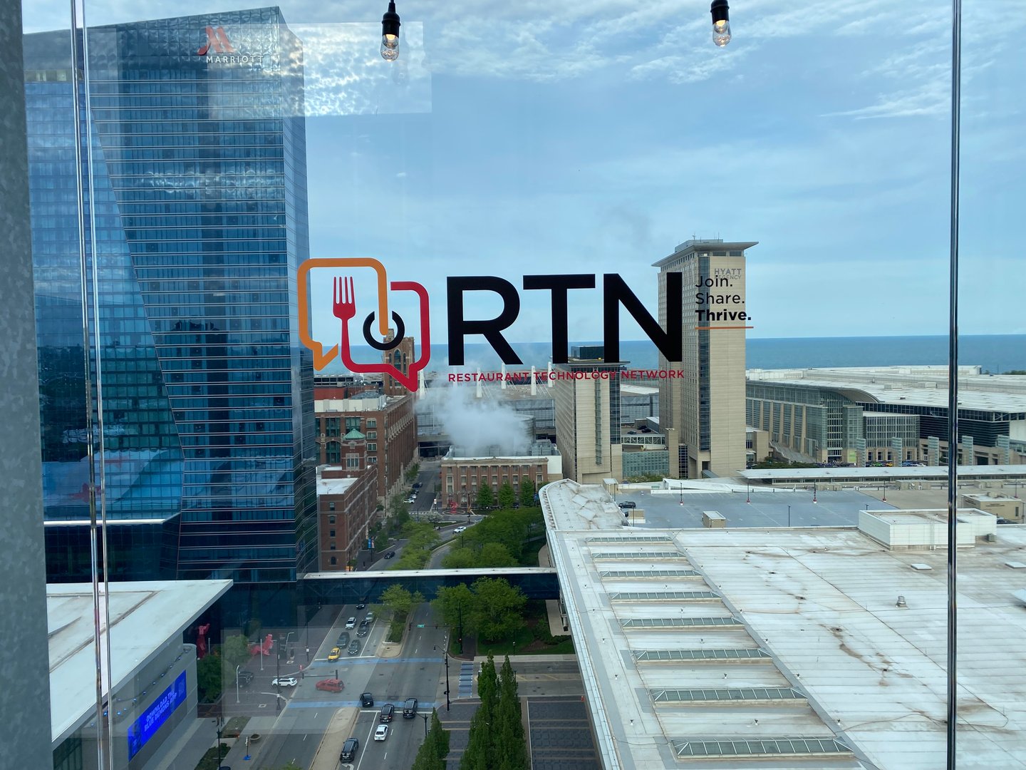 RTN window cling at Happy Hour 2025