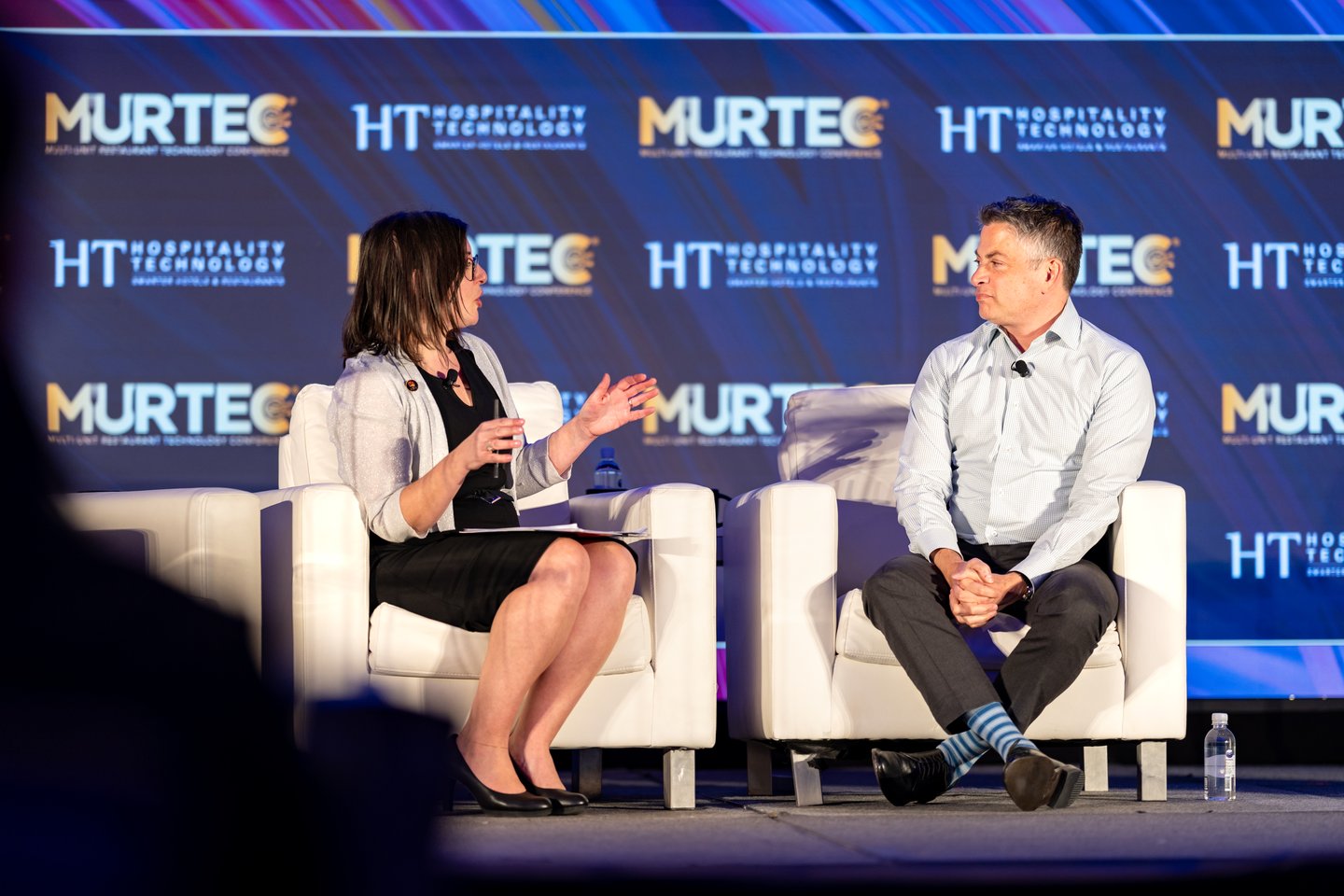 Abby Lorden and Dine Brands CEO John Peyton on stage at MURTEC 2024