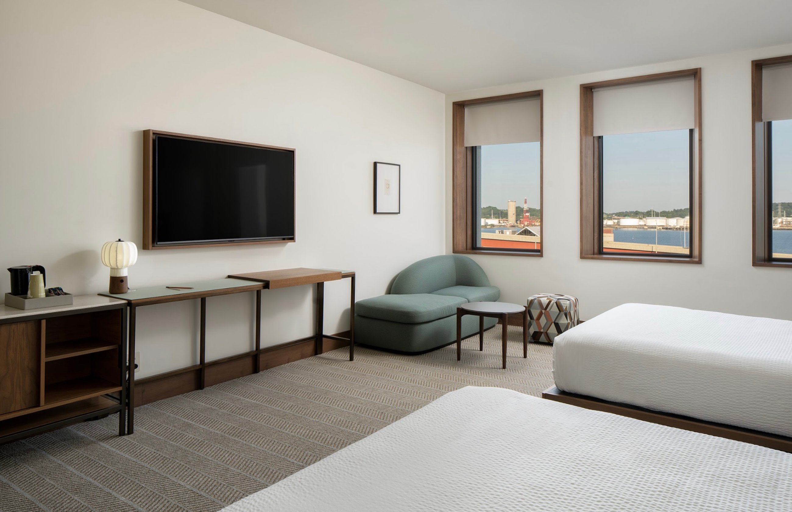 Hotel Marcel guestroom featuring automated window shades
