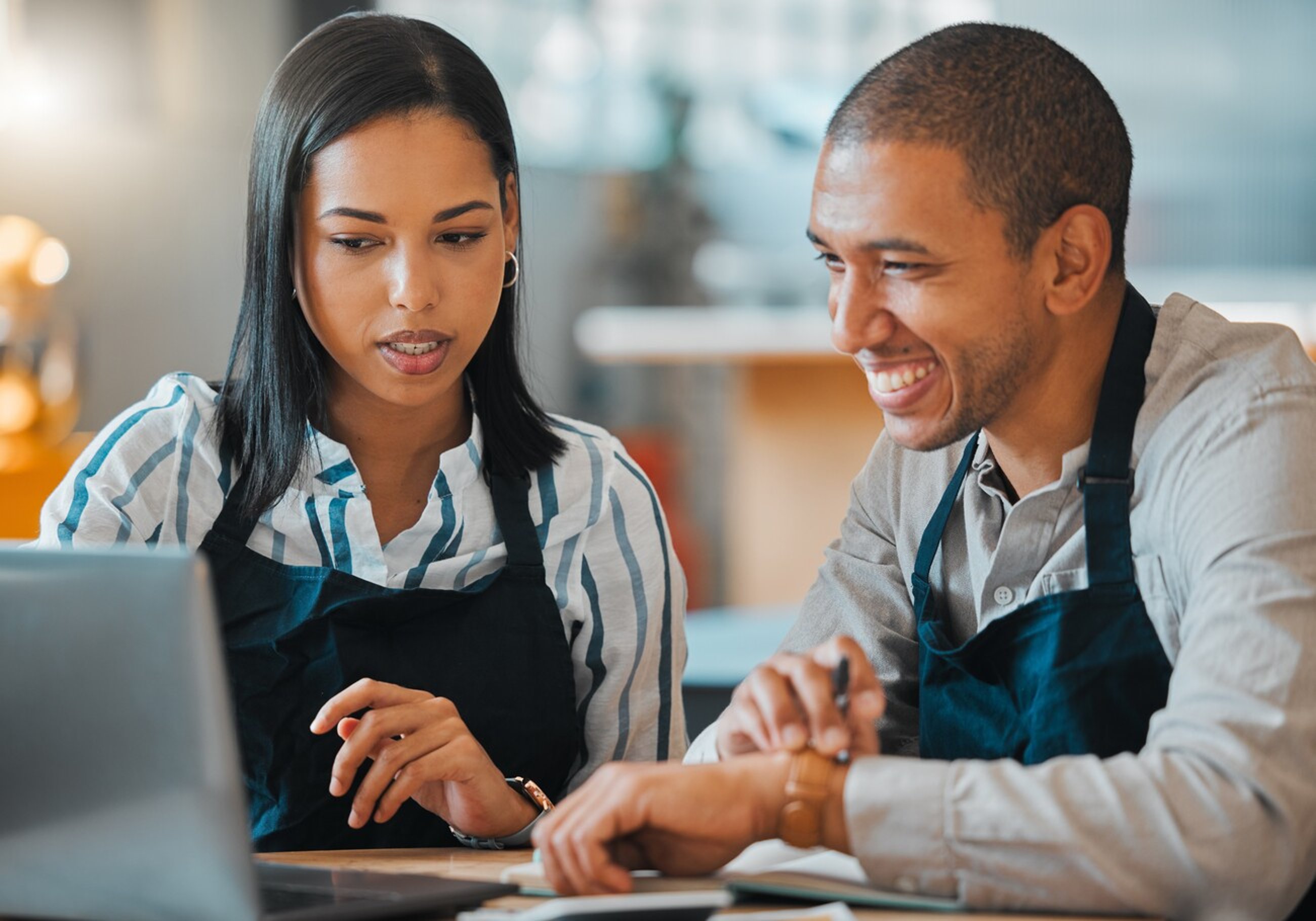 Waiter, laptop and cafe restaurant manager in small business meeting with employee for financial budget or inventory. Coffee shop, bakery worker planning or review marketing or advertising strategy; Shutterstock ID 2193761835