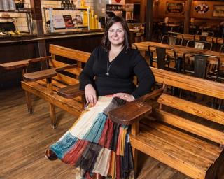 a person sitting on a wooden table