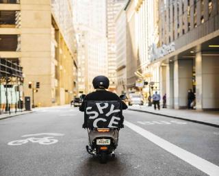a person riding a motorcycle on a city street