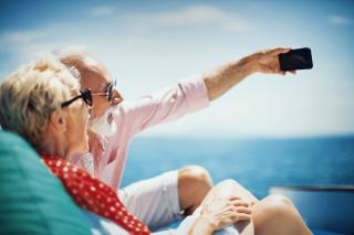 person,outdoor,water,woman,sitting,man,table,riding,people,holding,young,phone,playing,doing,ocean,board,boat,standing,bed,laying