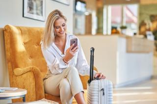 a woman sitting in a chair talking on the phone