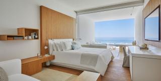 a bedroom with a large window