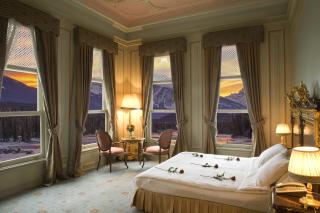 a bedroom with a large bed in a hotel room
