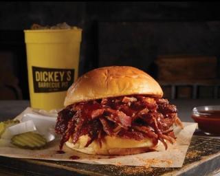 a sandwich sitting on top of a wooden table