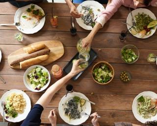 a bunch of food sitting on top of a wooden table