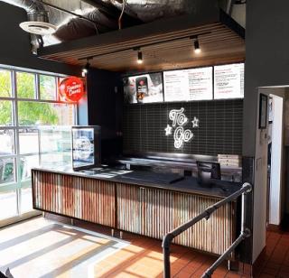 a kitchen with a wood floor