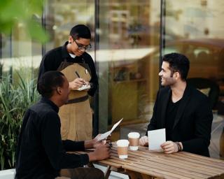 a group of people sitting at a table