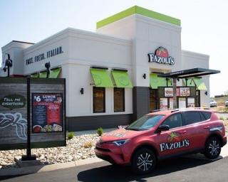 a car parked in front of a Fazoli's drive-thru