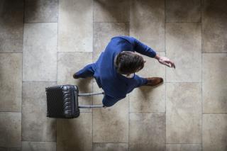 person,man,young,board,woman,standing,holding,doing,wearing,shirt,bowl,blue,kitchen