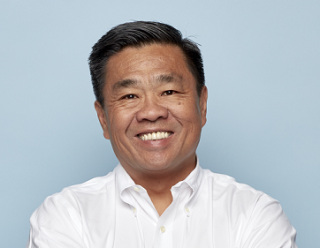 a man smiling for the camera