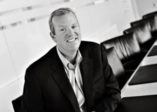 Stephen Talbot wearing a suit and tie