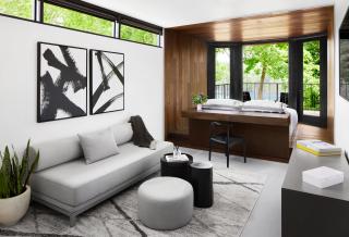 a living room filled with furniture and a large window