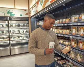 a person standing in front of a store