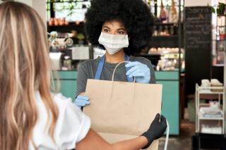 a woman standing in front of a store