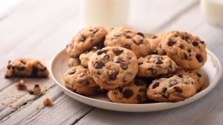 a plate of chocolate chip cookies