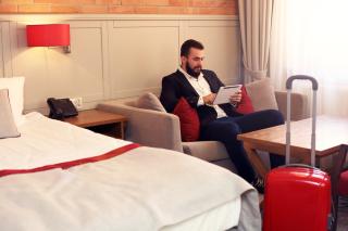 traveler in hotel room