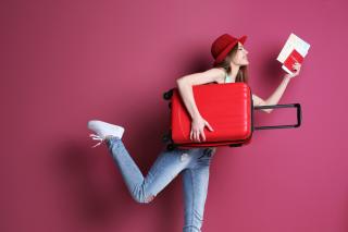 woman with suitcase and passport