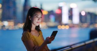 Woman using an app on her mobile phone