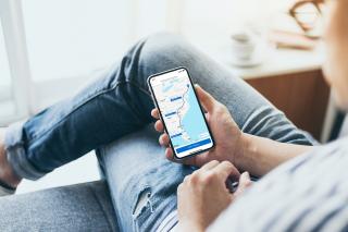 Person using the road trip planner feature on Wyndham Mobile app