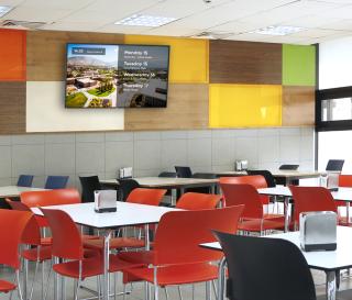 restaurant dining room using TVs for digital signage