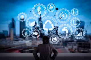 person in front of a city skyline with sustainability icons