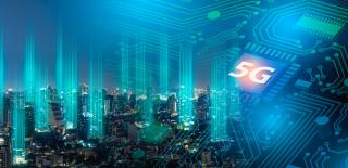 City skyline on top of a circuit board with 5G highlighted in the air