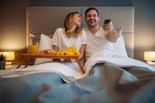 Hotel guests enjoy in-room entertainment shutterstock