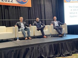 Panelists sitting on stage for the NFT, Crypto Panel at HITEC 2022