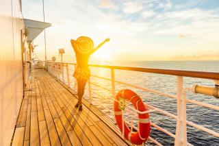 Sunset on a cruise ship with guest enjoying the ocean view