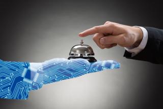 AI hand holding hotel bell for service