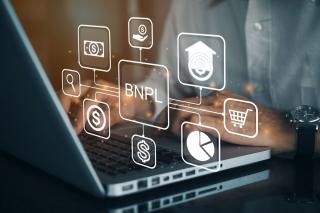 laptop computer showing buy now pay later icons